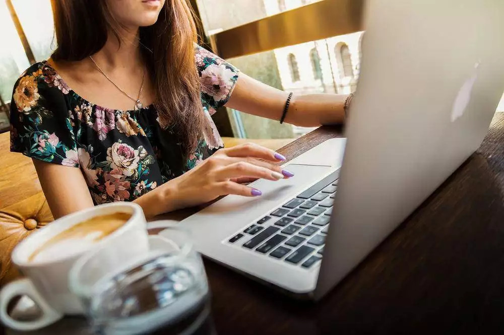 woman, laptop, desk. Is Working Smarter Better Than Working Harder? - Jake Smolarek - What Is Smart Work