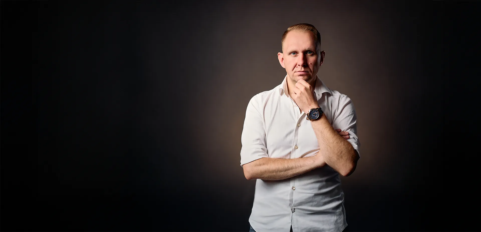 Authoritative portrait of Jake Smolarek, the systems-driven life coach and author of 'The Architecture of Human Performance'.