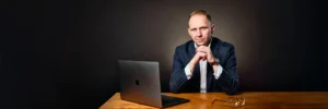 Authoritative portrait of Jake Smolarek, the business coach and architect of the 'No-BSt Operating System for CEOs and Founders'.