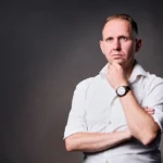 Jake Smolarek as a strategic thinker, visually representing a CEO dealing with the loneliness and intense pressure of leadership.