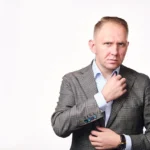 Jake Smolarek, an executive coach, demonstrating the intense analytical focus required to deconstruct the patterns of imposter syndrome in leaders.