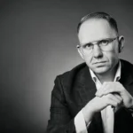 Jake Smolarek, Strategic Advisor and Succession Engineer for HNW families, author of "Raising Lions in a Zoo." A professional black-and-white portrait emphasising authority, expertise, and leadership in global wealth management and family governance.