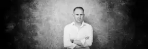 Portrait of Jake Smolarek, London-based high-performance coach, looking directly at the camera, reflecting on imposter syndrome.