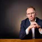 Jake Smolarek's portrait for an article on negotiation psychology, pressure, and deal regret